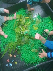Children exploring spaghetti butterfly